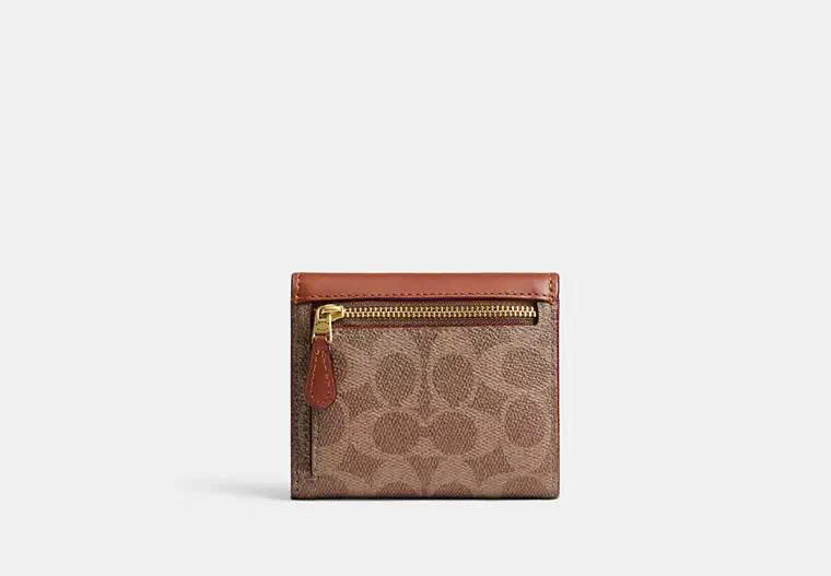 COACH CAT56 MILA SMALL FLAP WALLET IN SIGNATURE CANVAS - BROWN